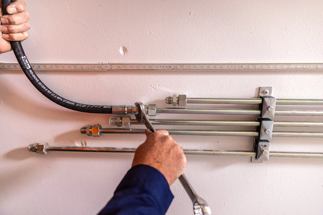ENZED HOSE DOCTOR beside a service truck