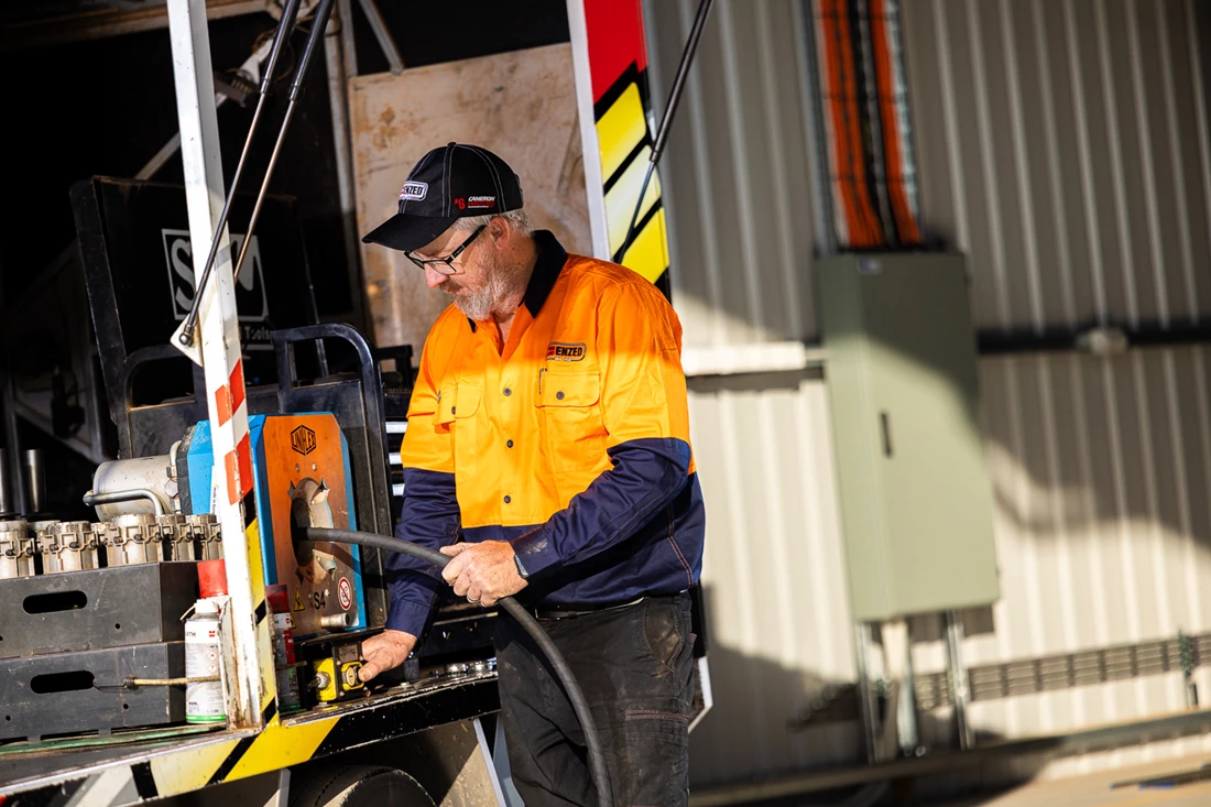 ENZED HOSE DOCTOR beside a service truck